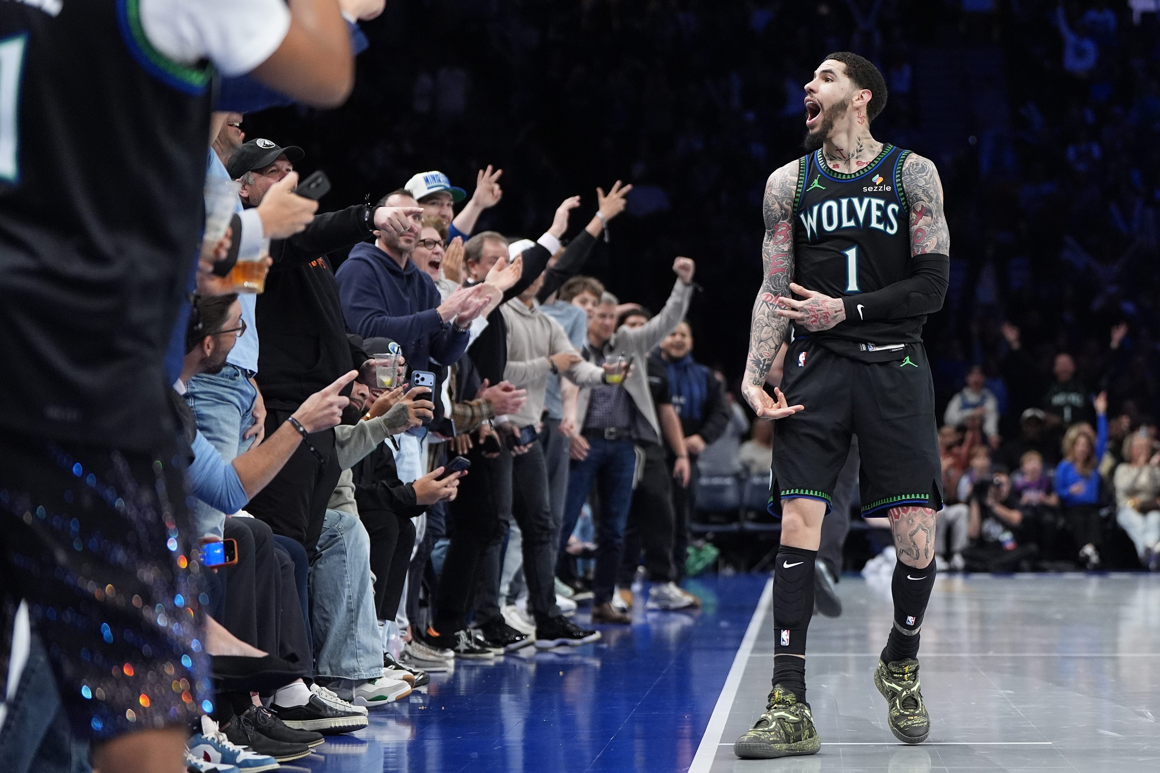 Timberwolves players celebrate after a win against the Clippers.